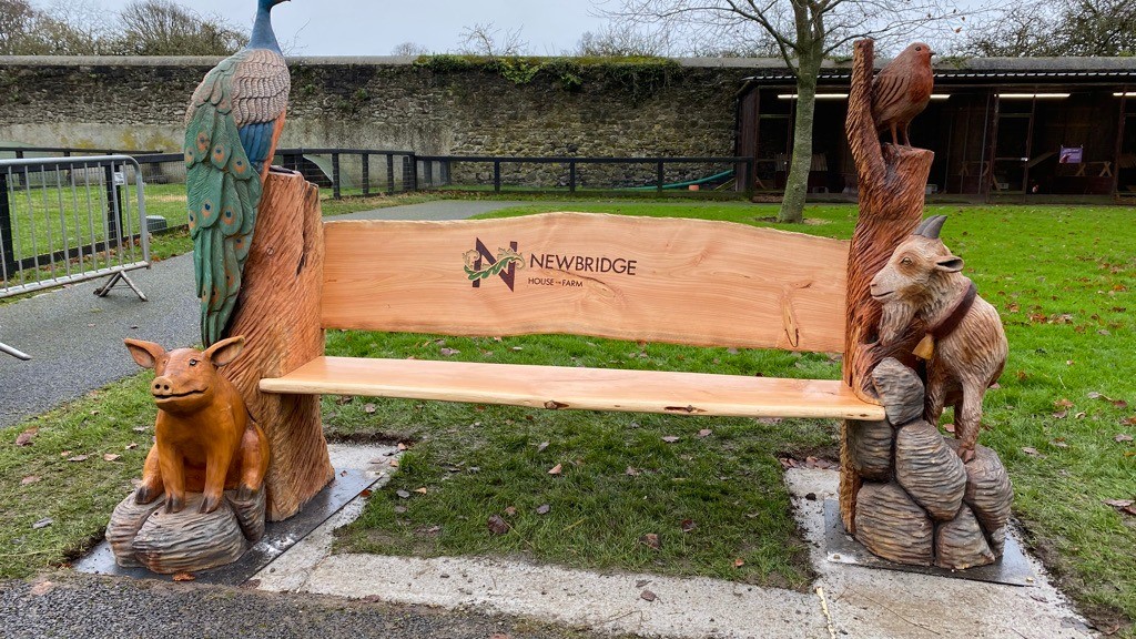 hand carved farm animal bench farm trail