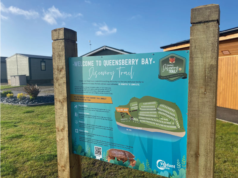 welcome sign for queensberry bay trail