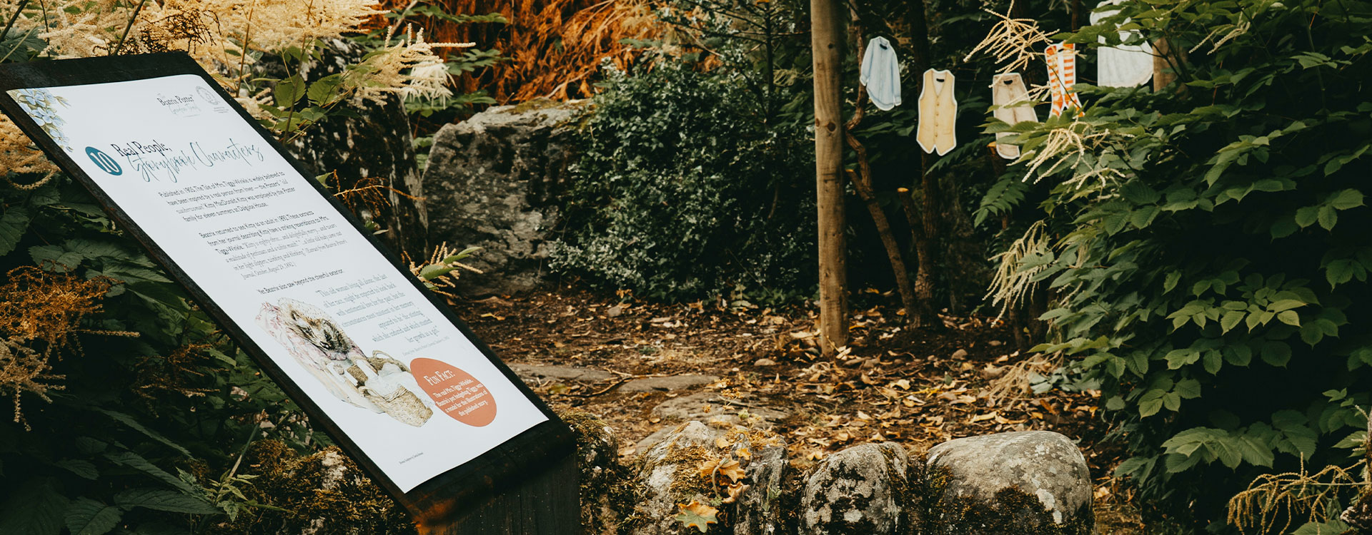 Beatrix Potter Garden Trail at Birnam Arts, featuring an interpretation panel and Mrs. Tiggy-Winkle’s missing washing hidden among the garden