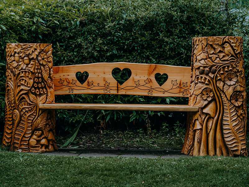 Bespoke woodland-themed carved bench at Birnam Arts.