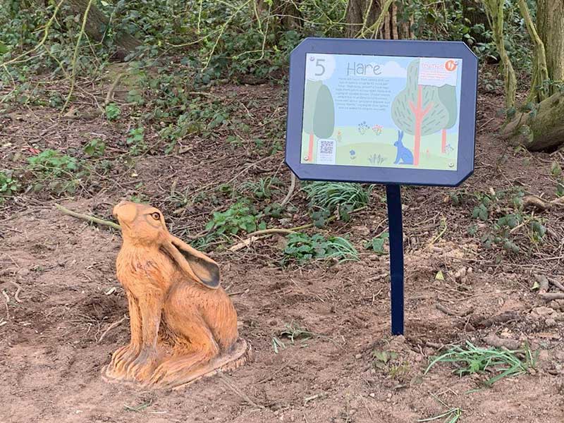 Hand-carved wooden hare sculpture on the Apley Farm Shop Nature Trail