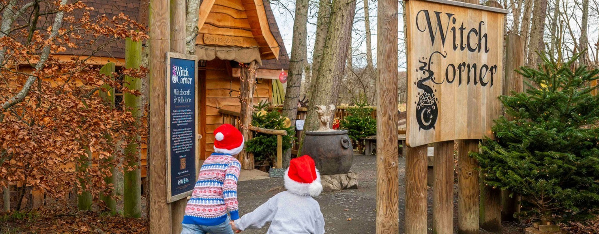 Children exploring a festive seasonal trail at Witch Corner in a woodland setting